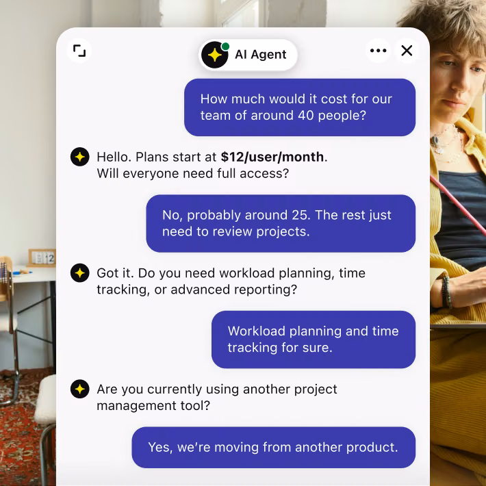 AI Agent chat answering a visitor's pricing question for a team of 40
