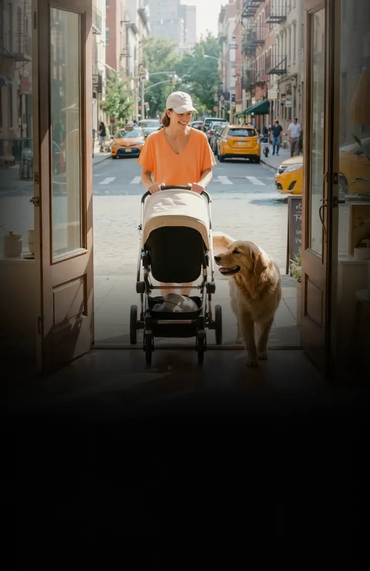A customer walking into a cozy retail store with a stroller and a dog, capturing a friendly in-store customer service moment.